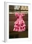 Pink flamenco dress for little girl hangs in Centro old district of Sevilla Spain-null-Framed Photographic Print