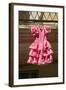 Pink flamenco dress for little girl hangs in Centro old district of Sevilla Spain-null-Framed Photographic Print