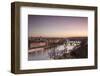 Pink sky on historical bridges and buildings reflected on Vltava River at sunset, Prague, Czech Rep-Roberto Moiola-Framed Photographic Print