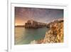 Pink sunrise on the turquoise sea framed by old town perched on the rocks, Polignano a Mare, Provin-Roberto Moiola-Framed Photographic Print