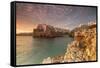 Pink sunrise on the turquoise sea framed by old town perched on the rocks, Polignano a Mare, Provin-Roberto Moiola-Framed Stretched Canvas