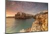 Pink sunrise on the turquoise sea framed by old town perched on the rocks, Polignano a Mare, Provin-Roberto Moiola-Mounted Photographic Print