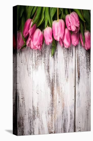 Pink Tulips over Wooden Table-oksix-Stretched Canvas