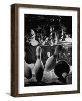 Pins Falling after Being Struck by Bowling Ball-null-Framed Photographic Print