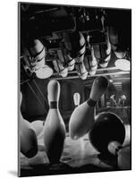 Pins Falling after Being Struck by Bowling Ball-null-Mounted Photographic Print