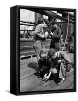 Pipefitters and Welders Discussing Installation During Shipbuilding Process-George Strock-Framed Stretched Canvas