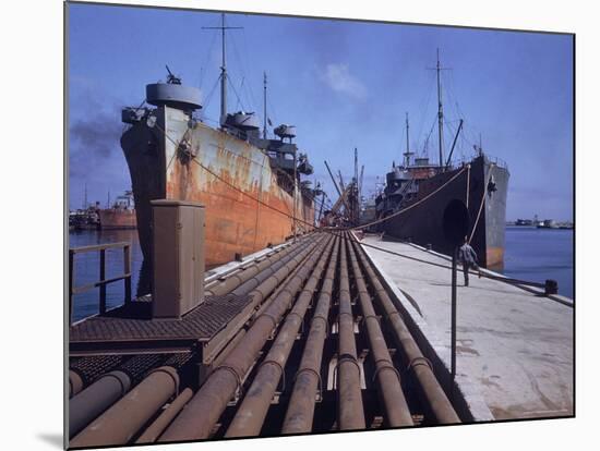 Pipeline Running to Loading Pier at Oil Refinery-Dmitri Kessel-Mounted Photographic Print