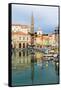 Piran, Primorska, Slovenia. View across harbour to Tartinijev trg (or square) and the spire of S...-null-Framed Stretched Canvas