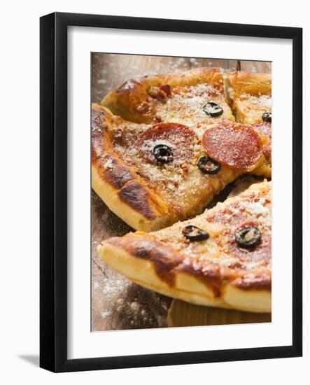 Pizza with Salami, Cheese and Olives, Pieces Cut-null-Framed Photographic Print