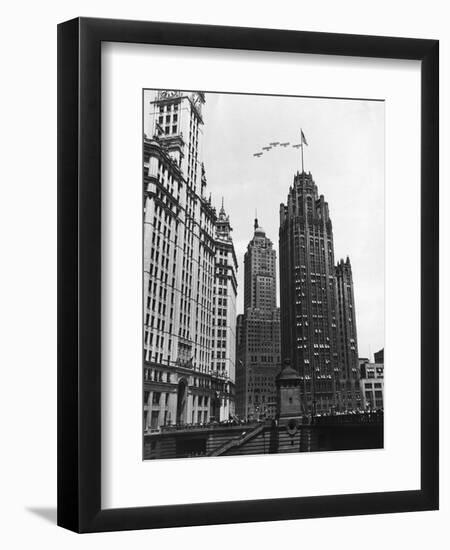 Planes Fly over Buildings in Chicago-null-Framed Photographic Print