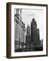 Planes Fly over Buildings in Chicago-null-Framed Photographic Print