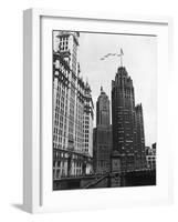 Planes Fly over Buildings in Chicago-null-Framed Photographic Print