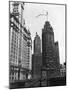 Planes Fly over Buildings in Chicago-null-Mounted Photographic Print