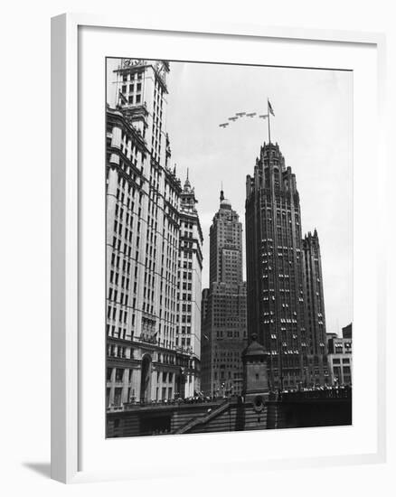 Planes Fly over Buildings in Chicago-null-Framed Photographic Print