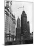 Planes Fly over Buildings in Chicago-null-Mounted Photographic Print