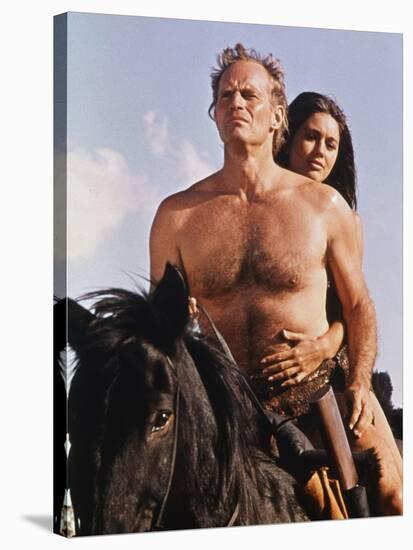 PLANET OF THE APES, 1968 directed by FRANKLYN J. SCHAFFNER Charlton Heston / Linda Harrison (photo)-null-Stretched Canvas