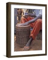 Playing a Congolese Drum in a Congolese Refugee Camp, Tanzania-Kristin Mosher-Framed Photographic Print