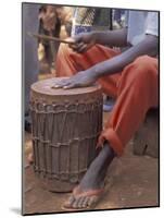 Playing a Congolese Drum in a Congolese Refugee Camp, Tanzania-Kristin Mosher-Mounted Photographic Print