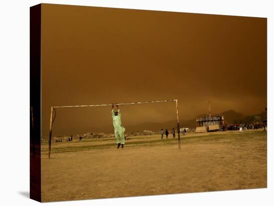 Playing a Friendly Soccer Match in a Park During a Sandstorm in Kabul, Afghanistan-null-Stretched Canvas