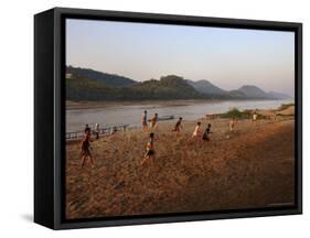 Playing Football on the Banks of the Mekong River, Luang Prabang, Laos, Indochina-Andrew Mcconnell-Framed Stretched Canvas