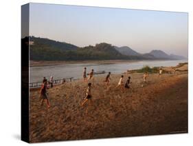 Playing Football on the Banks of the Mekong River, Luang Prabang, Laos, Indochina-Andrew Mcconnell-Stretched Canvas