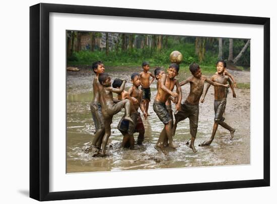 Playing Football-Angela Muliani Hartojo-Framed Photographic Print