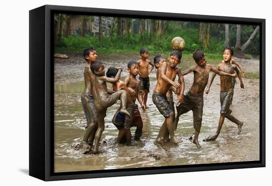 Playing Football-Angela Muliani Hartojo-Framed Stretched Canvas