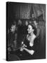 Playwright Jean Kerr Holding a Rose Sitting in the Audience, Watches Her Play "King of Hearts"-Alfred Eisenstaedt-Stretched Canvas