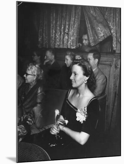 Playwright Jean Kerr Holding a Rose Sitting in the Audience, Watches Her Play "King of Hearts"-Alfred Eisenstaedt-Mounted Premium Photographic Print