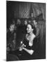 Playwright Jean Kerr Holding a Rose Sitting in the Audience, Watches Her Play "King of Hearts"-Alfred Eisenstaedt-Mounted Premium Photographic Print