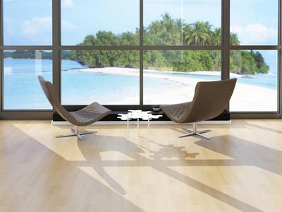 Two Lounge Chairs Against Huge Window with Seascape View