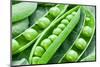 Pods of Green Peas on a Background of Leaves-Volff-Mounted Photographic Print