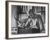 Poet Rod McKuen Playing Record on Stereo Set While Pet Siamese Cat Nuzzles His Face Affectionately-Ralph Crane-Framed Premium Photographic Print