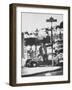 Poet Rod McKuen Swinging from Sign Which is Title of One His Songs, Stanyan Street-Ralph Crane-Framed Photographic Print