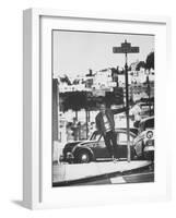 Poet Rod McKuen Swinging from Sign Which is Title of One His Songs, Stanyan Street-Ralph Crane-Framed Photographic Print