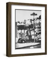 Poet Rod McKuen Swinging from Sign Which is Title of One His Songs, Stanyan Street-Ralph Crane-Framed Photographic Print