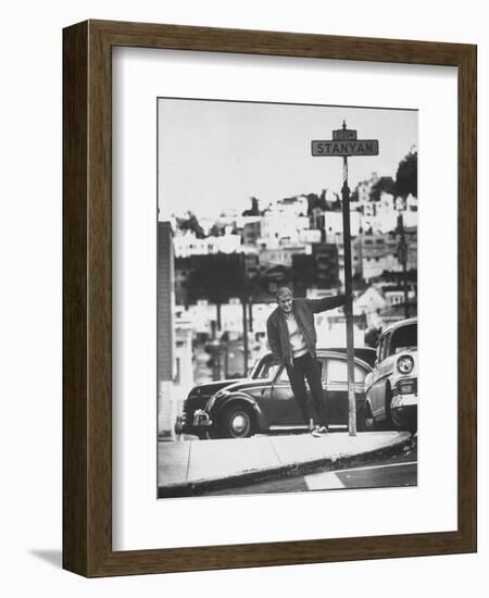 Poet Rod McKuen Swinging from Sign Which is Title of One His Songs, Stanyan Street-Ralph Crane-Framed Photographic Print