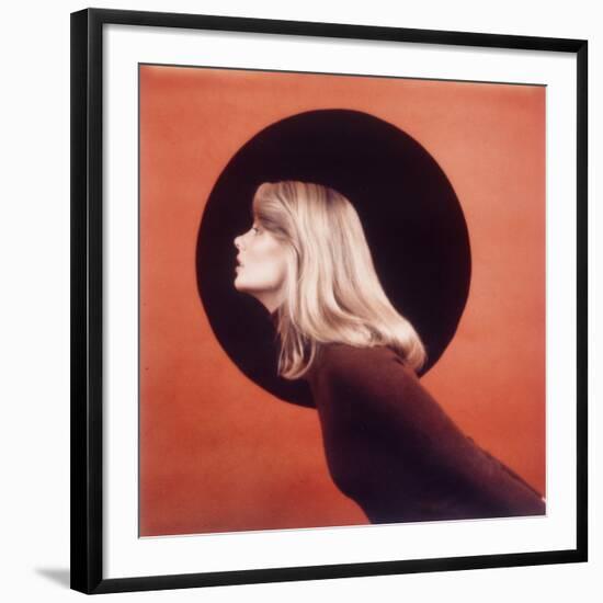 Polaroid, Profile of Woman in Brown Sweather Against Red Bkgd with Black Circle-Co Rentmeester-Framed Photographic Print