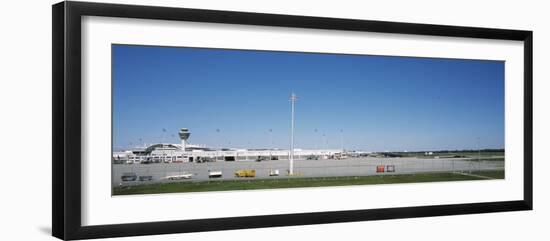 Pole and Vehicle Trailers at an Airport, Munich Airport, Munich, Bavaria, Germany-null-Framed Photographic Print