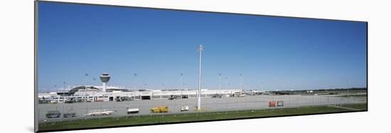 Pole and Vehicle Trailers at an Airport, Munich Airport, Munich, Bavaria, Germany-null-Mounted Photographic Print