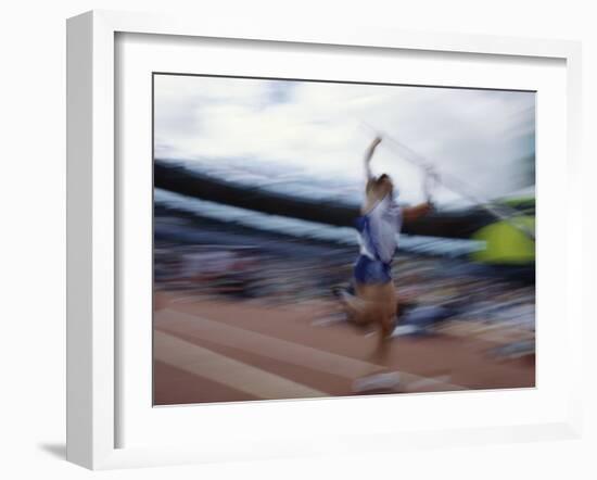 Pole Vaulter Flys over the Bar-Steven Sutton-Framed Photographic Print