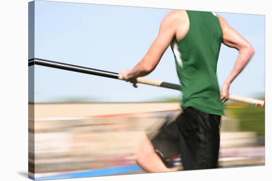 Pole Vaulter Running down the Runway (Motion Blur)-soupstock-Stretched Canvas