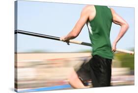 Pole Vaulter Running down the Runway (Motion Blur)-soupstock-Stretched Canvas