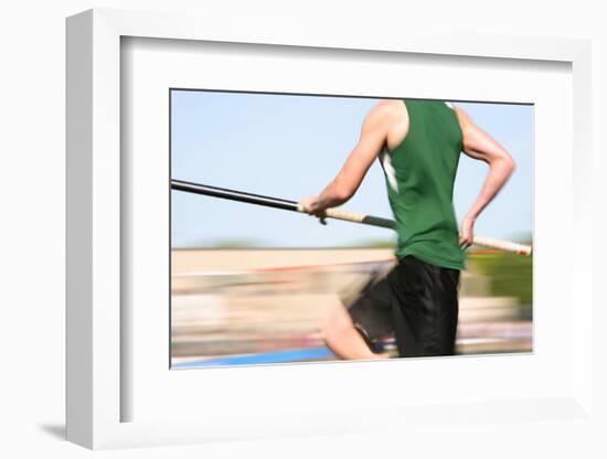 Pole Vaulter Running down the Runway (Motion Blur)-soupstock-Framed Photographic Print