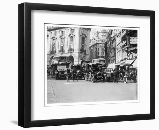 Policeman Directs Traffic Through Piccadilly Circus-null-Framed Photographic Print