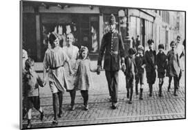 Policeman Helping Schoolchildren across the Road, East End, London, 1926-1927-null-Mounted Giclee Print