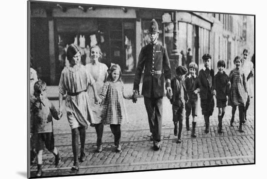 Policeman Helping Schoolchildren across the Road, East End, London, 1926-1927-null-Mounted Premium Giclee Print