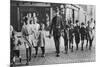 Policeman Helping Schoolchildren across the Road, East End, London, 1926-1927-null-Mounted Giclee Print