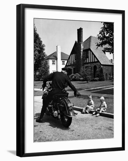 Policeman on Motorcycle Chatting with Toddler Boys Sitting on Curb-Alfred Eisenstaedt-Framed Photographic Print