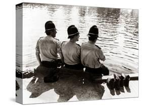 Policemen Sitting by a River on a Hot Sunny Day, July 1976-null-Stretched Canvas